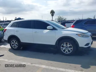 2015 Mazda CX-9 Sport with VIN JM3TB2BAXF0453244, listed as a IAAI auction lot 41905847 with 128,764 mi miles and . Bid and sale history available at carsss.com. Image 13.