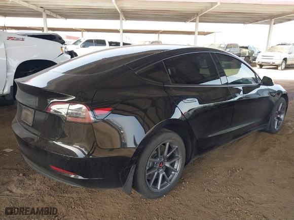 2022 Tesla Model 3 Long Range with VIN 5YJ3E1EBXNF185973, listed as a IAAI auction lot 41692577 with 131,513 mi miles. Bid and sale history available at carsss.com. Image 4.