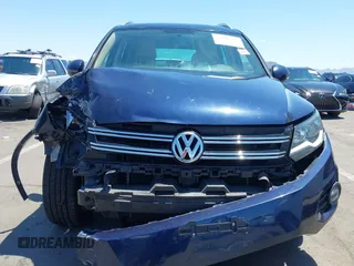 2015 Volkswagen Tiguan SE with VIN WVGAV7AX8FW595806, listed as a IAAI auction lot 42644395 with 51,638 mi miles and . Bid and sale history available at DreamBid. Image 13.