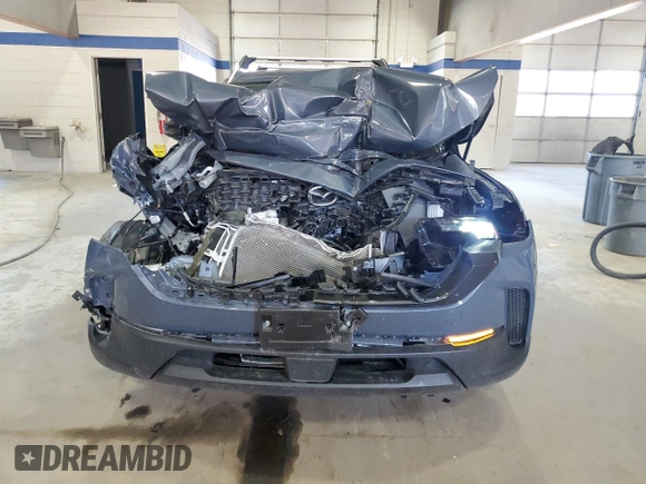 2024 Mazda CX-50 S Preferred with VIN 7MMVABBM5RN195804, listed as a Copart auction lot 50973435 with 6,817 mi miles and Salvage Title. Bid and sale history available at DreamBid. Image 5.
