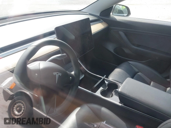 2020 Tesla Model 3 Standard Range Plus with VIN 5YJ3E1EAXLF643807, listed as a IAAI auction lot 41789406 with 49,256 mi miles. Bid and sale history available at carsss.com. Image 7.