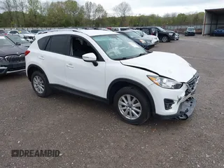 2016 Mazda CX-5 Touring with VIN JM3KE4CY0G0903723, listed as a IAAI auction lot 41966516 with 107,569 mi miles. Bid and sale history available at carsss.com. Image 1.