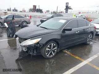 2018 Nissan Altima 2.5 SV with VIN 1N4AL3AP9JC117719, listed as a IAAI auction lot 41720521 with 103,541 mi miles. Bid and sale history available at carsss.com. Image 2.