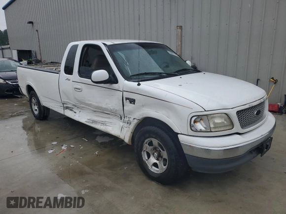 1999 Ford F-150 z VIN 1FTRX17WXXNC10010, wystawiony jako Copart lot #55607785 z przebiegiem Nie podano mil oraz Szkoda całkowita • Salvage title. Historia ofert i sprzedaży dostępna na DreamBid. Obrazek 4.