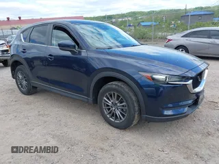 2020 Mazda CX-5 Touring z VIN JM3KFBCM1L0737009, wystawiony jako IAAI lot #42209767 z przebiegiem 61 654 mil mil oraz . Historia ofert i sprzedaży dostępna na DreamBid. Obrazek 1.
