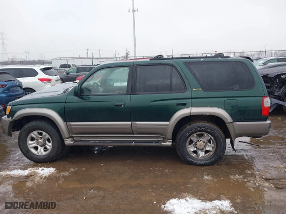 2000 Toyota 4Runner Limited with VIN JT3HN87R6Y0265299, listed as a IAAI auction lot 41569862 with 216,917 mi miles. Bid and sale history available at carsss.com. Image 14.
