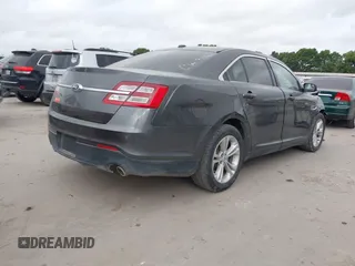 2015 Ford Taurus SEL with VIN 1FAHP2E8XFG161616, listed as a IAAI auction lot 42049199 with 138,565 mi miles and . Bid and sale history available at carsss.com. Image 4.