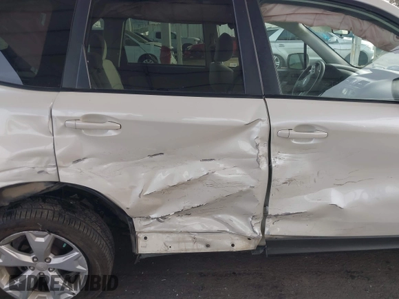 2015 Subaru Forester Premium with VIN JF2SJAFCXFH489984, listed as a IAAI auction lot 41082317 with 146,244 mi miles and . Bid and sale history available at DreamBid. Image 6.