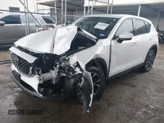 2023 Mazda CX-5 2.5 S Premium Package with VIN JM3KFBDM7P0165562, listed as a IAAI auction lot 41458088 with 35,168 mi miles. Bid and sale history available at carsss.com. Image 2.