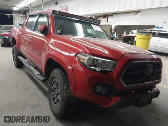 2018 Toyota Tacoma SR with VIN 3TMCZ5AN0JM166978, listed as a IAAI auction lot 41936143 with 129,674 mi miles. Bid and sale history available at carsss.com. Image 1.