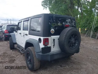 2014 Jeep Wrangler Unlimited Sport with VIN 1C4BJWDG9EL135077, listed as a IAAI auction lot 42324775 with 104,221 mi miles and . Bid and sale history available at DreamBid. Image 3.