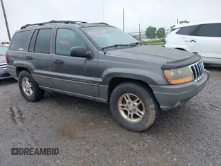 2002 Jeep Grand Cherokee with VIN 1J4GW38N62C190851, listed as a IAAI auction lot 42519384 with 142,066 mi miles and . Bid and sale history available at DreamBid. Image 1.