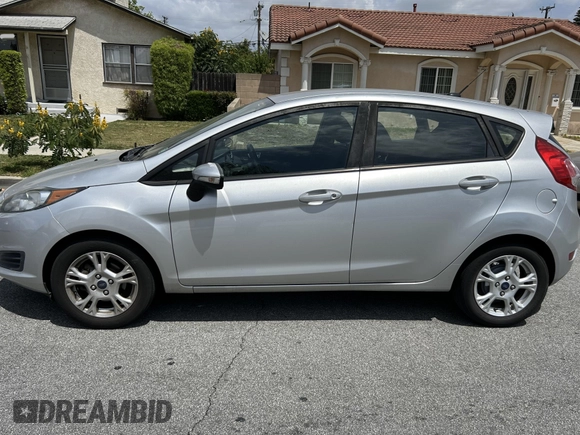 2015 Ford Fiesta SE z VIN 3FADP4EJ8FM167515, wystawiony jako IAAI lot #42153873 z przebiegiem 100 559 mil mil oraz . Historia ofert i sprzedaży dostępna na DreamBid. Obrazek 13.