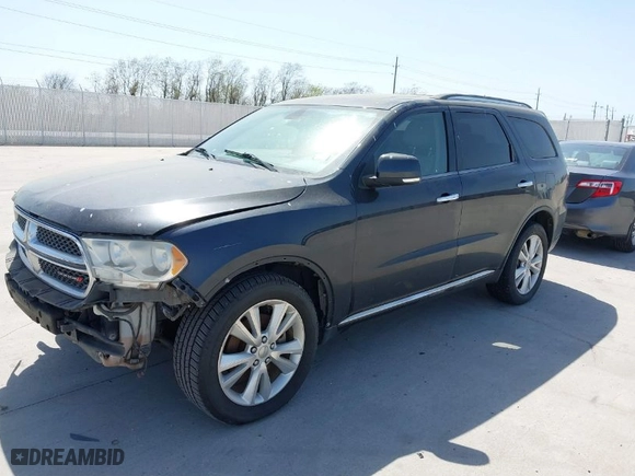 2013 Dodge Durango Crew with VIN 1C4SDHDT5DC637535, listed as a IAAI auction lot 41867982 with 162,569 mi miles. Bid and sale history available at carsss.com. Image 2.