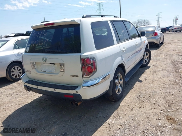2007 Honda Pilot EX-L with VIN 5FNYF18567B032406, listed as a IAAI auction lot 42120219 with 205,687 mi miles. Bid and sale history available at carsss.com. Image 4.