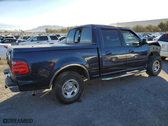 2002 Ford F-150 XLT with VIN 1FTRW07652KE28329, listed as a Copart auction lot 86346454 with 209,720 mi miles and Salvage Title. Bid and sale history available at carsss.com. Image 3.