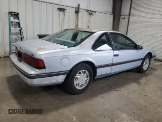 1990 Ford Thunderbird with VIN 1FAPP6047LH140817, listed as a Copart auction lot 83910194 with 177,909 mi miles and Salvage Title. Bid and sale history available at DreamBid. Image 3.