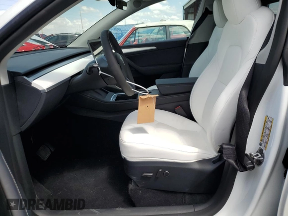 2025 Tesla Model Y Long Range with VIN 7SAYGDED4SF232433, listed as a Copart auction lot 51504015 with Not Provided miles and Salvage Title. Bid and sale history available at DreamBid. Image 7.