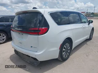 2023 Chrysler Pacifica Hybrid Touring L with VIN 2C4RC1L71PR622474, listed as a IAAI auction lot 42595061 with 55,880 mi miles and . Bid and sale history available at DreamBid. Image 4.