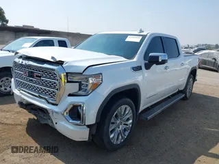 2021 GMC Sierra 1500 Denali z VIN 3GTU9FEL1MG349215, wystawiony jako IAAI lot #42585810 z przebiegiem 97 465 mil mil oraz . Historia ofert i sprzedaży dostępna na DreamBid. Obrazek 2.
