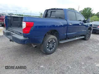 2019 Nissan Titan XD SV with VIN 1N6BA1F46KN514637, listed as a IAAI auction lot 41986617 with 123,872 mi miles. Bid and sale history available at carsss.com. Image 4.