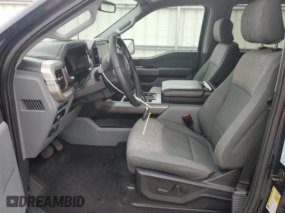 2023 Ford F-150 Lightning Pro with VIN 1FT6W1EV8PWG38071, listed as a Copart auction lot 51091495 with 13,687 mi miles and Salvage title. Bid and sale history available at DreamBid. Image 7.