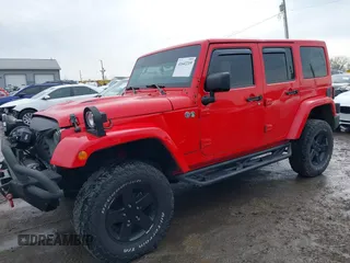 2015 Jeep Wrangler Unlimited Sahara with VIN 1C4BJWEG3FL590491, listed as a IAAI auction lot 41642219 with 148,759 mi miles. Bid and sale history available at carsss.com. Image 13.