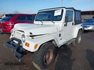 2002 Jeep Wrangler Sahara with VIN 1J4FA59S62P772256, listed as a IAAI auction lot 41968844 with 170,218 mi miles. Bid and sale history available at carsss.com. Image 2.