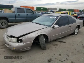 1994 Ford Thunderbird LX with VIN 1FALP6241RH110457, listed as a Copart auction lot 76384254 with 54,653 mi miles and Salvage Title. Bid and sale history available at DreamBid. Image 1.