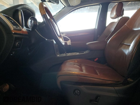 2013 Jeep Grand Cherokee Overland with VIN 1C4RJECT6DC526743, listed as a Copart auction lot 50203065 with 186,673 mi miles and Salvage Title. Bid and sale history available at DreamBid. Image 7.
