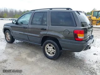 2004 Jeep Grand Cherokee Laredo with VIN 1J4GX48N74C412982, listed as a IAAI auction lot 41496258 with 195,671 mi miles. Bid and sale history available at carsss.com. Image 3.