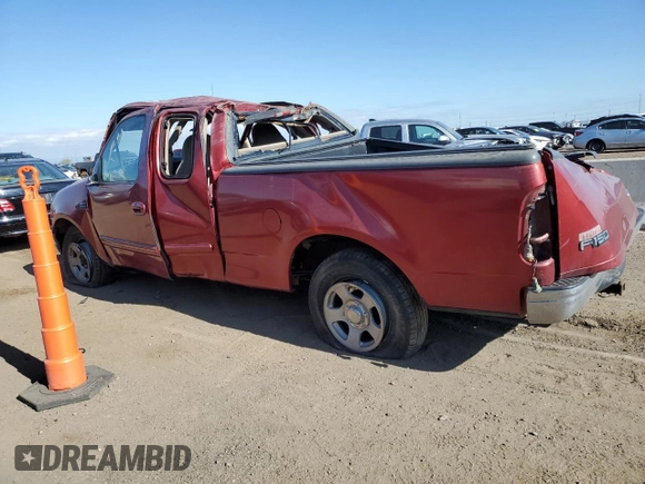 2000 Ford F-150 XL with VIN 1FTZX1728YNA87502, listed as a Copart auction lot 54870295 with 219,971 mi miles and Salvage title. Bid and sale history available at DreamBid. Image 2.