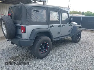 2014 Jeep Wrangler Unlimited Sport with VIN 1C4BJWDG3EL135351, listed as a IAAI auction lot 41947408 with 104,460 mi miles. Bid and sale history available at carsss.com. Image 4.