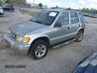 2001 Kia Sportage with VIN KNDJB723115706221, listed as a IAAI auction lot 41562713 with 99,378 mi miles. Bid and sale history available at carsss.com. Image 2.