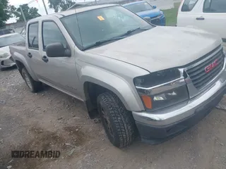 2004 GMC Canyon 1SE SLE Z71 z VIN 1GTDS136348155876, wystawiony jako IAAI lot #42420547 z przebiegiem 134 478 mil mil oraz . Historia ofert i sprzedaży dostępna na DreamBid. Obrazek 1.