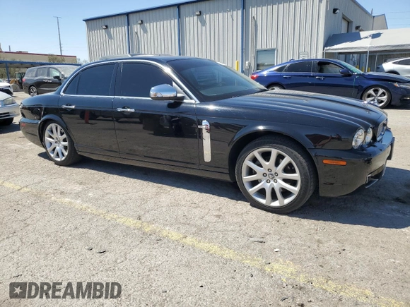 2009 Jaguar XJ 8 with VIN SAJWA71B79SH30431, listed as a Copart auction lot 52403185 with 67,143 mi miles and Salvage Title. Bid and sale history available at DreamBid. Image 4.