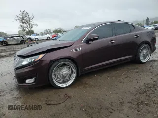 2014 Kia Optima EX with VIN 5XXGN4A79EG329448, listed as a Copart auction lot 50991095 with 103,879 mi miles and Salvage Title. Bid and sale history available at carsss.com. Image 1.