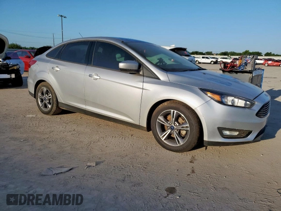 2018 Ford Focus SE z VIN 1FADP3F2XJL277462, wystawiony jako Copart lot #60360985 z przebiegiem 81 831 mil mil oraz Czysty tytuł • Clean title. Historia ofert i sprzedaży dostępna na DreamBid. Obrazek 4.