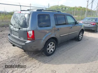2011 Honda Pilot Touring with VIN 5FNYF4H90BB103824, listed as a IAAI auction lot 42127137 with 243,858 mi miles and . Bid and sale history available at carsss.com. Image 4.