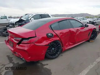 2022 BMW 8 Series M850i z VIN WBAGV8C04NCH90015, wystawiony jako IAAI lot #42020711 z przebiegiem 39 801 mil mil oraz . Historia ofert i sprzedaży dostępna na DreamBid. Obrazek 4.