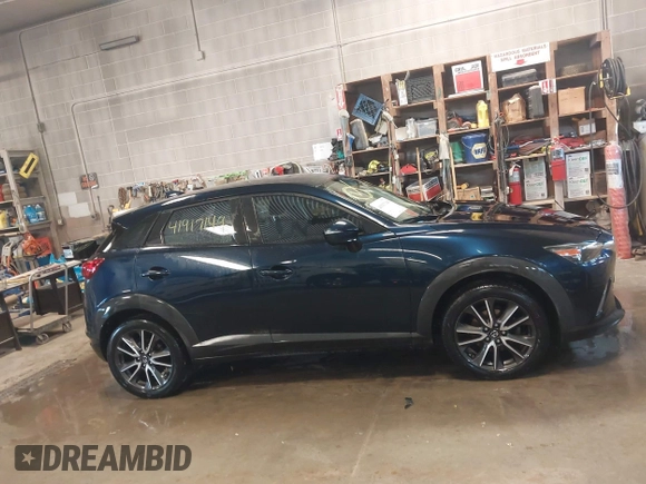 2017 Mazda CX-3 Touring with VIN JM1DKFC72H0145267, listed as a IAAI auction lot 41917149 with 55,784 mi miles. Bid and sale history available at carsss.com. Image 13.