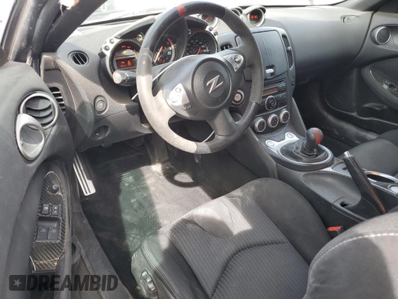 2014 Nissan 370Z z VIN JN1AZ4EH0EM630751, wystawiony jako Copart lot #51489825 z przebiegiem 125 107 mil mil oraz Czysty tytuł • Clean title. Historia ofert i sprzedaży dostępna na DreamBid. Obrazek 8.