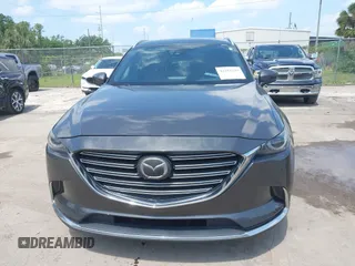 2016 Mazda CX-9 Signature with VIN JM3TCBEY9G0100579, listed as a IAAI auction lot 42282293 with 142,700 mi miles and . Bid and sale history available at DreamBid. Image 6.
