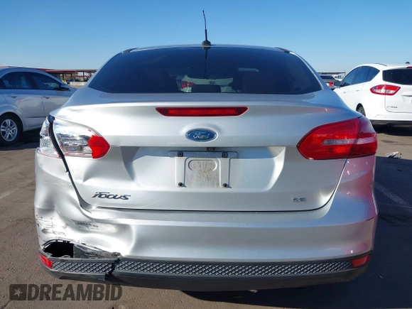 2018 Ford Focus SE z VIN 1FADP3F27JL204873, wystawiony jako IAAI lot #41657504 z przebiegiem 99 224 mil mil oraz . Historia ofert i sprzedaży dostępna na DreamBid. Obrazek 16.
