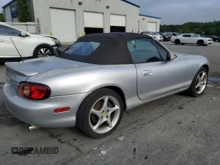 2003 Mazda MX-5 Miata Cloth z VIN JM1NB353630305964, wystawiony jako Copart lot #58517505 z przebiegiem 129 675 mil mil oraz Szkoda całkowita • Salvage title. Historia ofert i sprzedaży dostępna na DreamBid. Obrazek 3.