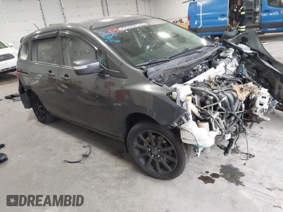 2014 Mazda 5 Sport z VIN JM1CW2BLXE0164748, wystawiony jako IAAI lot #42064606 z przebiegiem 140 169 mil mil oraz . Historia ofert i sprzedaży dostępna na DreamBid. Obrazek 1.