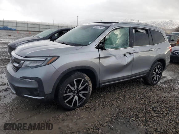 2020 Honda Pilot Touring 8-Passenger with VIN 5FNYF6H9XLB042625, listed as a Copart auction lot 86412804 with 52,061 mi miles and Salvage Title. Bid and sale history available at DreamBid. Image 1.