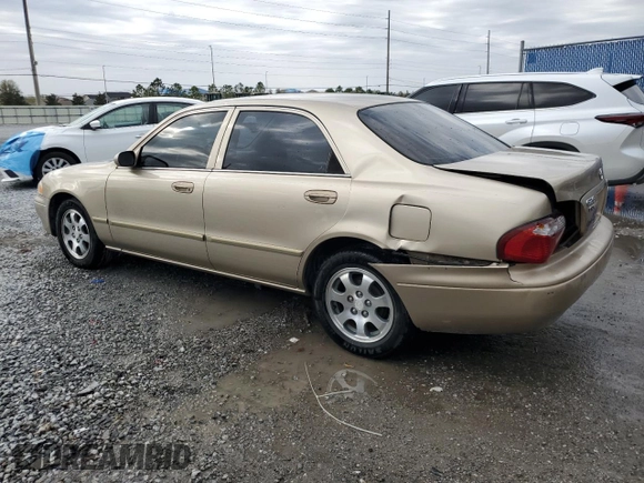 2001 Mazda 626 LX z VIN 1YVGF22CX15238033, wystawiony jako Copart lot #47245985 z przebiegiem 91 735 mil mil oraz Szkoda całkowita • Salvage title. Historia ofert i sprzedaży dostępna na DreamBid. Obrazek 2.