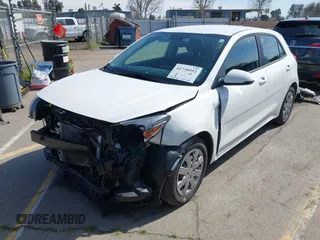 2023 Kia Rio S with VIN 3KPA25AD0PE629868, listed as a IAAI auction lot 41738952 with 25,642 mi miles and . Bid and sale history available at DreamBid. Image 23.