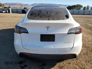 2020 Tesla Model Y Long Range with VIN 5YJYGDEE4LF015455, listed as a Copart auction lot 84223984 with 77,398 mi miles and Salvage Title. Bid and sale history available at DreamBid. Image 6.